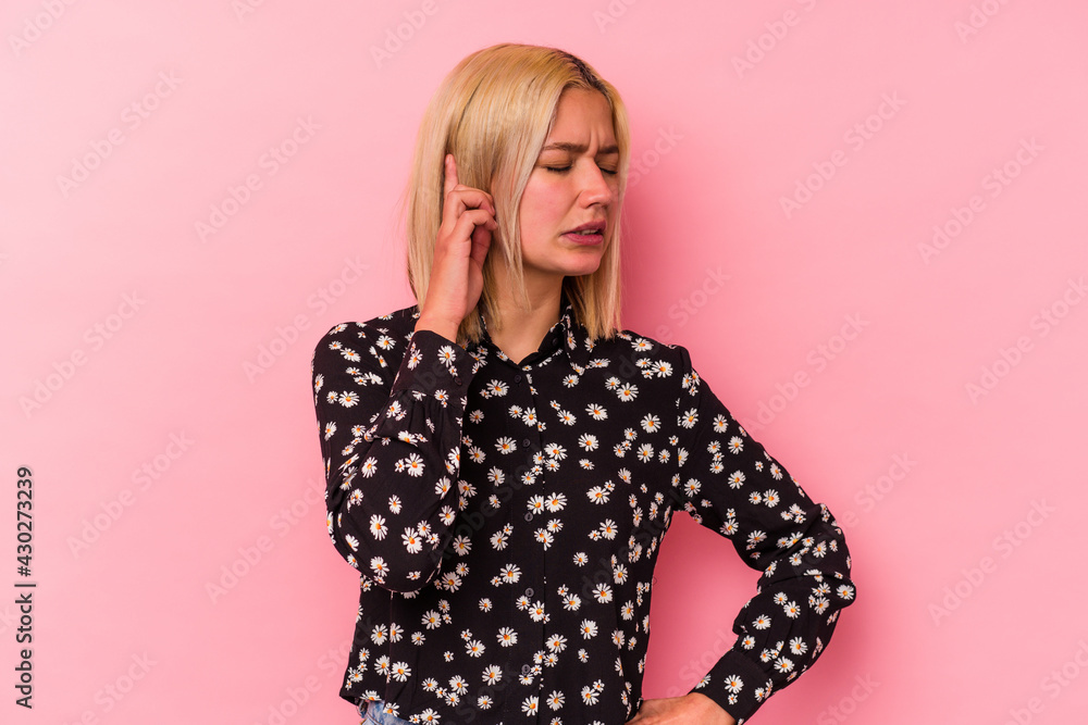 Young venezuelan woman isolated on pink background covering ears with hands. Young venezuelan woman isolated on pink background covering ears with hands.