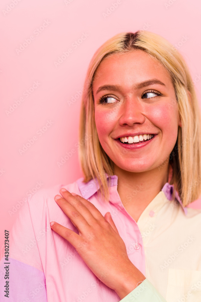 Young caucasian woman face closeup isolated on pink background Young caucasian woman face closeup isolated on pink background