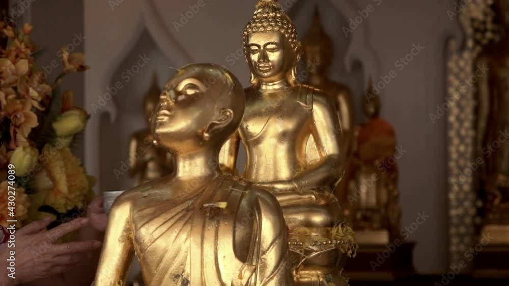 Sprinkle water onto Buddha Statue during Songkran festival in Thailand. Sprinkle water onto Buddha Statue during Songkran festival in Thailand.