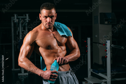 Stay hydrated concept. Weightlifter gym man preparing for training. Muscular athletic body. Sport health. Proper nutrition. © Volodymyr