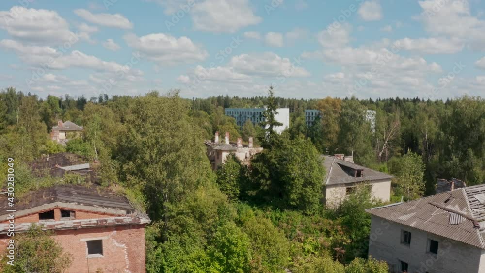 aerial view of abandoned and destroyed buildings from the times of the USSR in a green picturesque place in summer aerial view of abandoned and destroyed buildings from the times of the USSR in a green picturesque place in summer