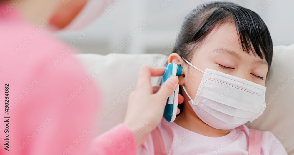 Mom use ear thermometer