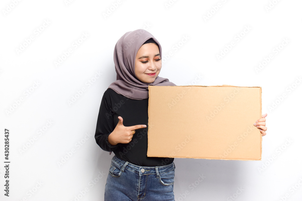 Showing blank sign poster for inscription and text of Young beautiful muslim asian women dress Veil(Hijab) and black shirt isolated on white background Showing blank sign poster for inscription and text of Young beautiful muslim asian women dress Veil(Hijab) and black shirt isolated on white background