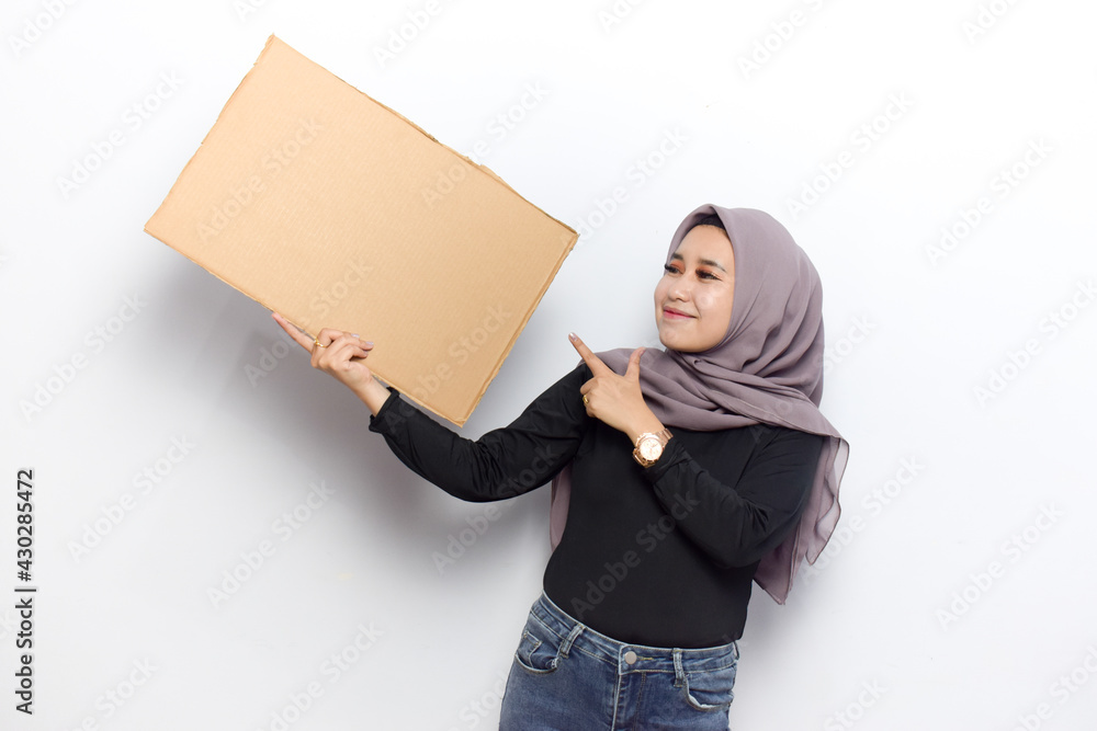 Showing blank sign poster for inscription and text of Young beautiful muslim asian women dress Veil(Hijab) and black shirt isolated on white background Showing blank sign poster for inscription and text of Young beautiful muslim asian women dress Veil(Hijab) and black shirt isolated on white background