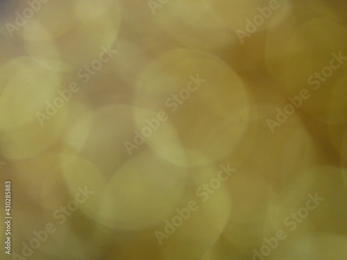 Golden and silver bokeh background image.