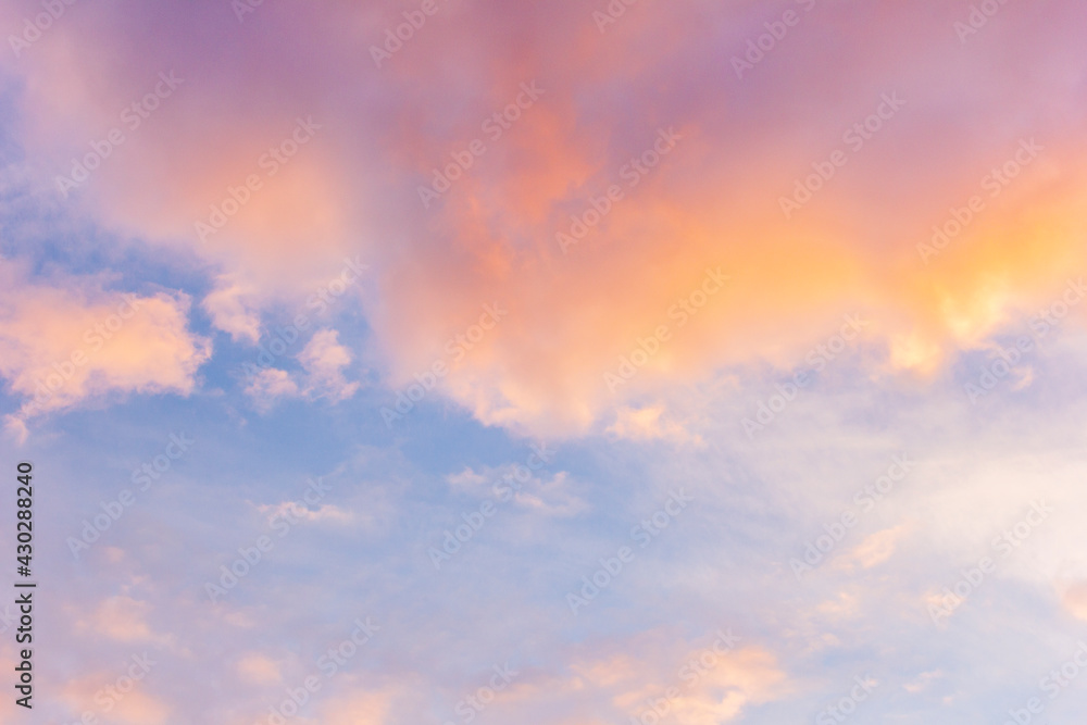 Sunset sky with floating clouds .beautiful cloud illuminated by the sun .concept background sky replacement .blue pink orange colors. Sunset sky with floating clouds .beautiful cloud illuminated by the sun .concept background sky replacement .blue pink orange colors.