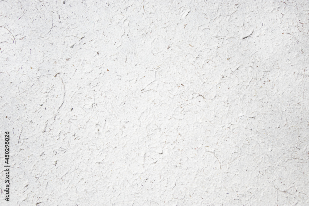 Obraz premium White textured paper background made of elephant poo. Colorful natural material wallpaper and background. Eco friendly materials in sustainable concept. White and textured cover and background.