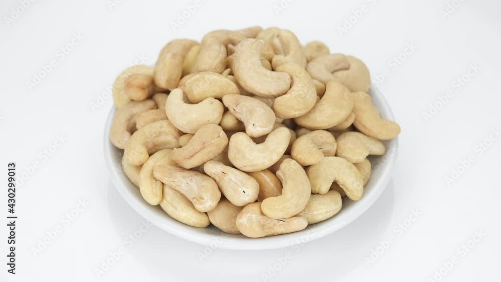 cashew nuts isolated on white background, rotation. Healthy Food. 4K UHD video cashew nuts isolated on white background, rotation. Healthy Food. 4K UHD video