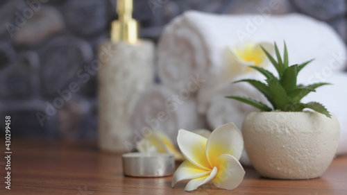 close up of Plumeria Spa accessories Beautiful composition of spa   spa relax concept   herbs for massage  beautiful sap set on wood table For marketing products