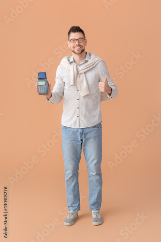 Man with payment terminal s...