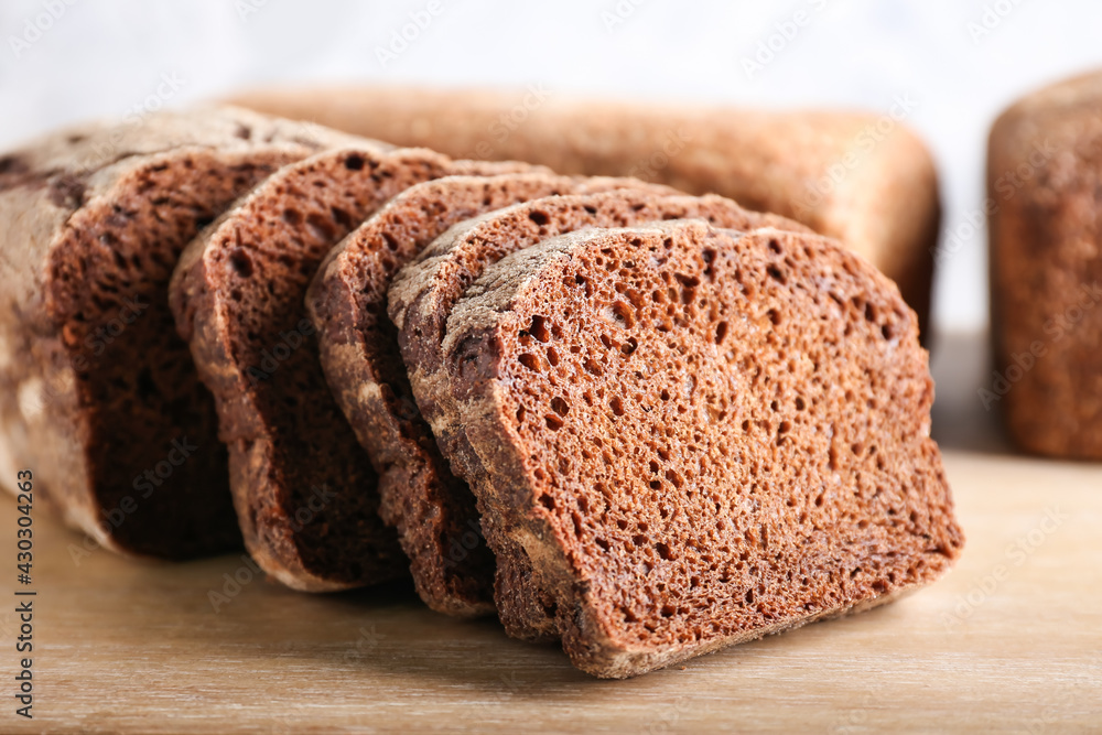 Fresh bread on wooden background, closeup Fresh bread on wooden background, closeup