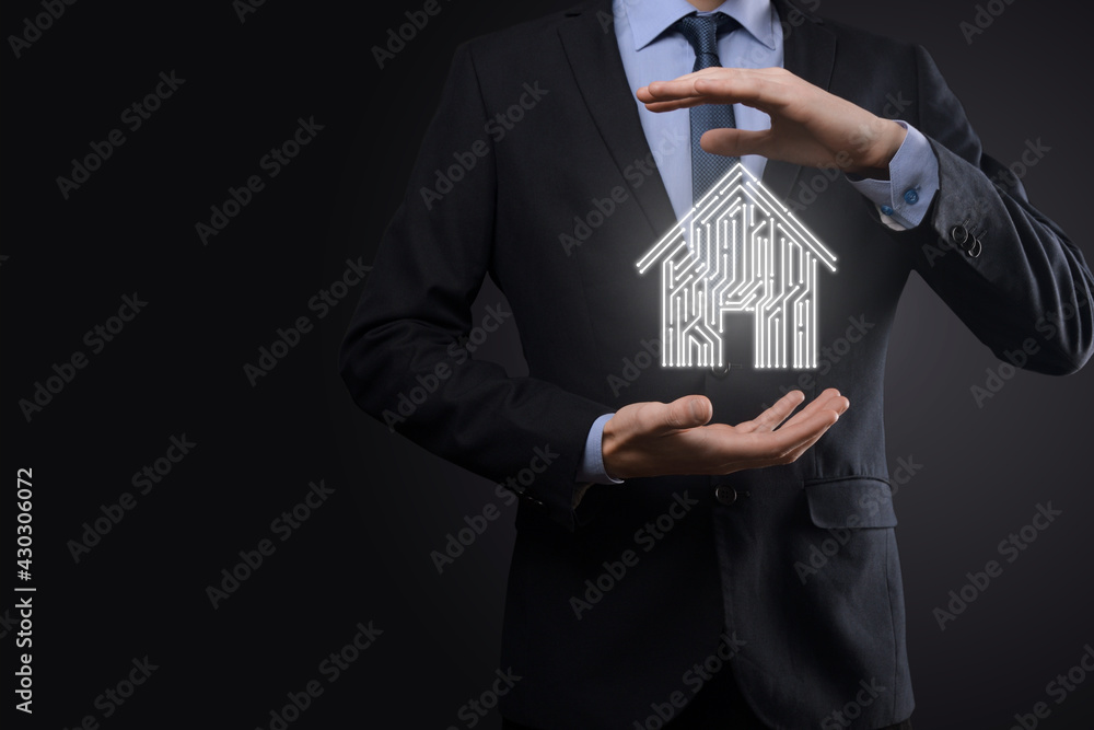 Businessman hold house icon.Smart home controlled, intelligent house, and home automation app concept.Pcb design and person with smart phone. Innovation technology internet Network Concept. Businessman hold house icon.Smart home controlled, intelligent house, and home automation app concept.Pcb design and person with smart phone. Innovation technology internet Network Concept.