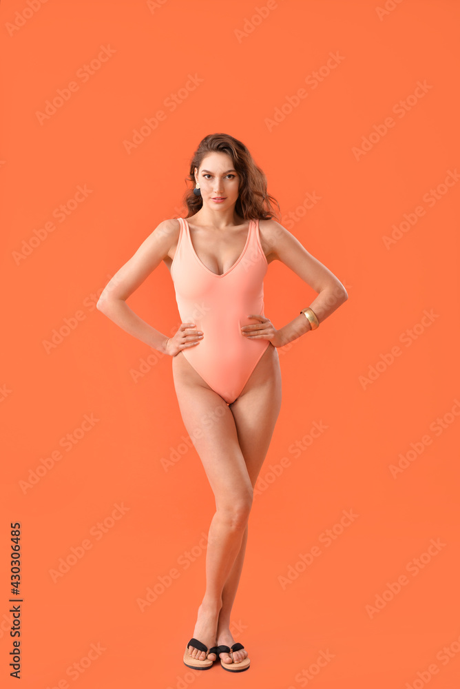 Beautiful young woman in swimsuit on color background Beautiful young woman in swimsuit on color background