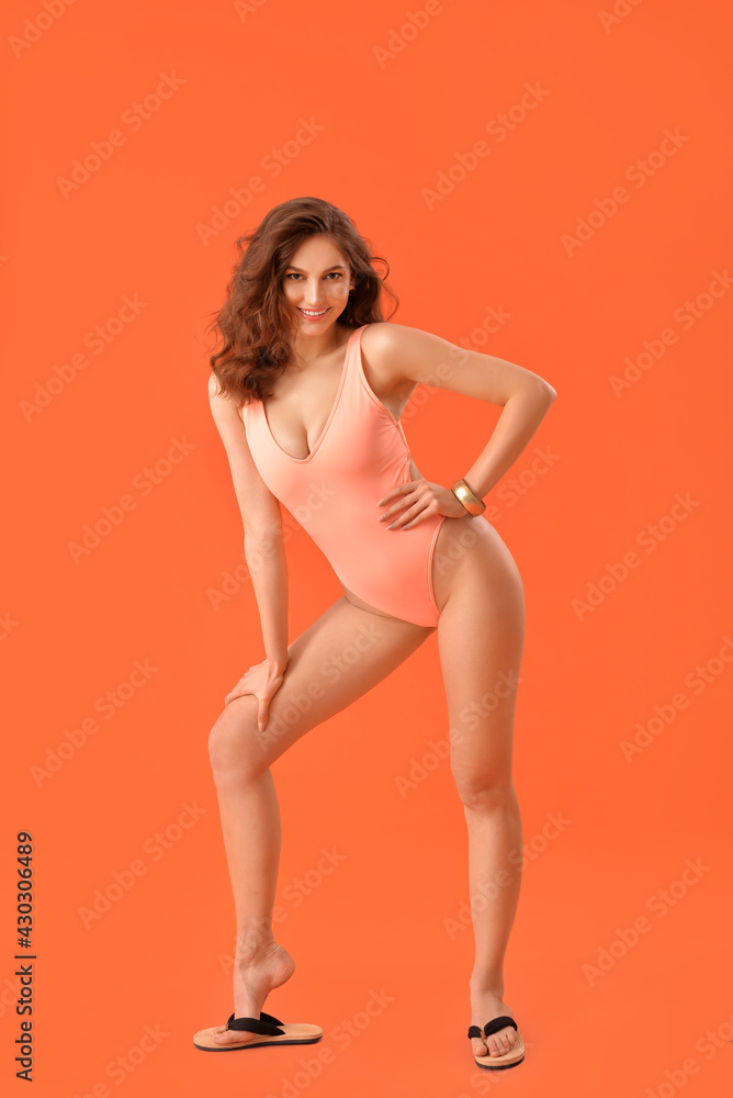Beautiful young woman in swimsuit on color background Beautiful young woman in swimsuit on color background