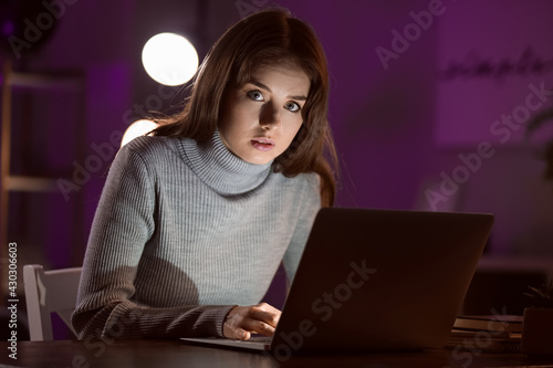 Young woman using laptop la...