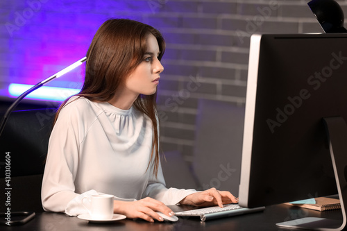 Young woman using computer ...