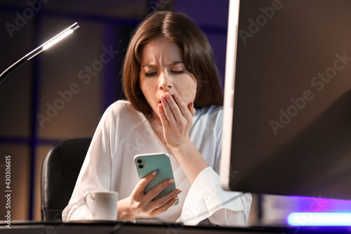 Sleepy young woman with mob...