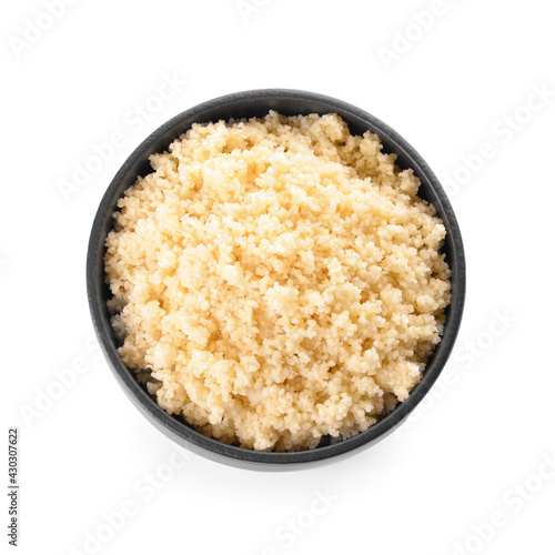 Bowl with tasty couscous on white background