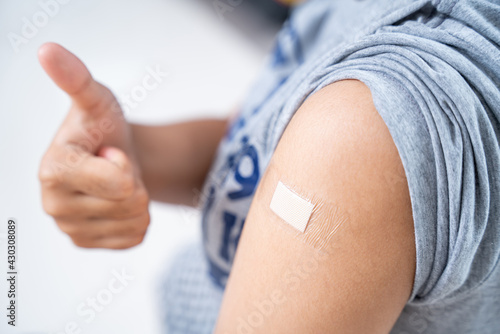 Konstfotografi Close up of teens girls in the shoulder with plaster on arm after vaccination in