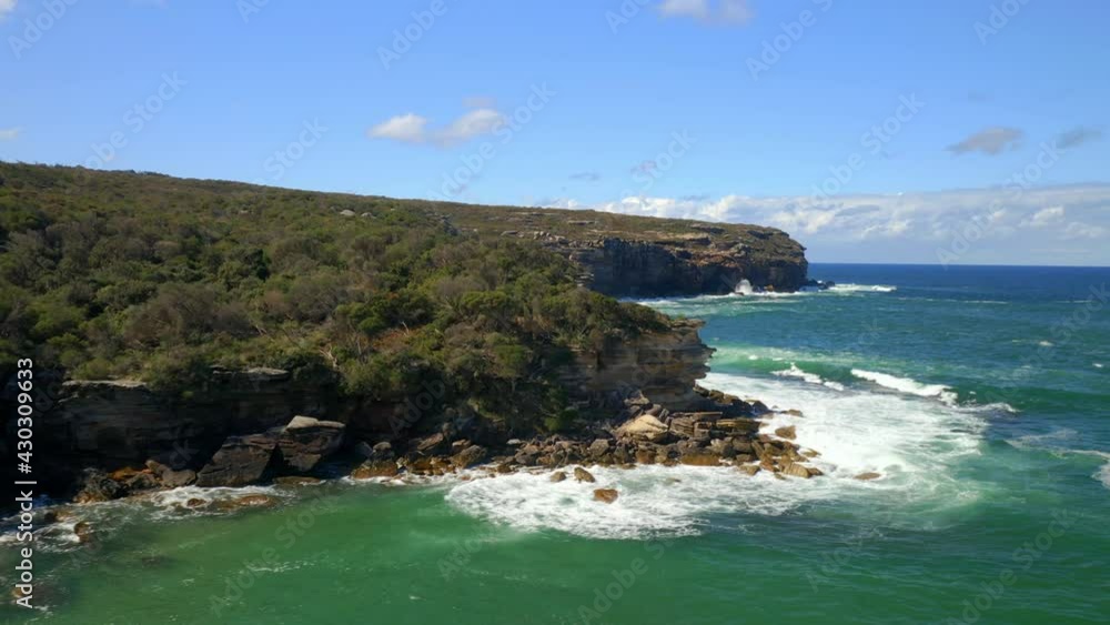 Rocky Cliff Edge With Foamy Sea Waves In Summer At Royal National Park, South Of Sydney, New South Wales, Australia. - Aerial Shot Rocky Cliff Edge With Foamy Sea Waves In Summer At Royal National Park, South Of Sydney, New South Wales, Australia. - Aerial Shot