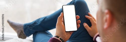 Banner sized photo of man using mobile phone