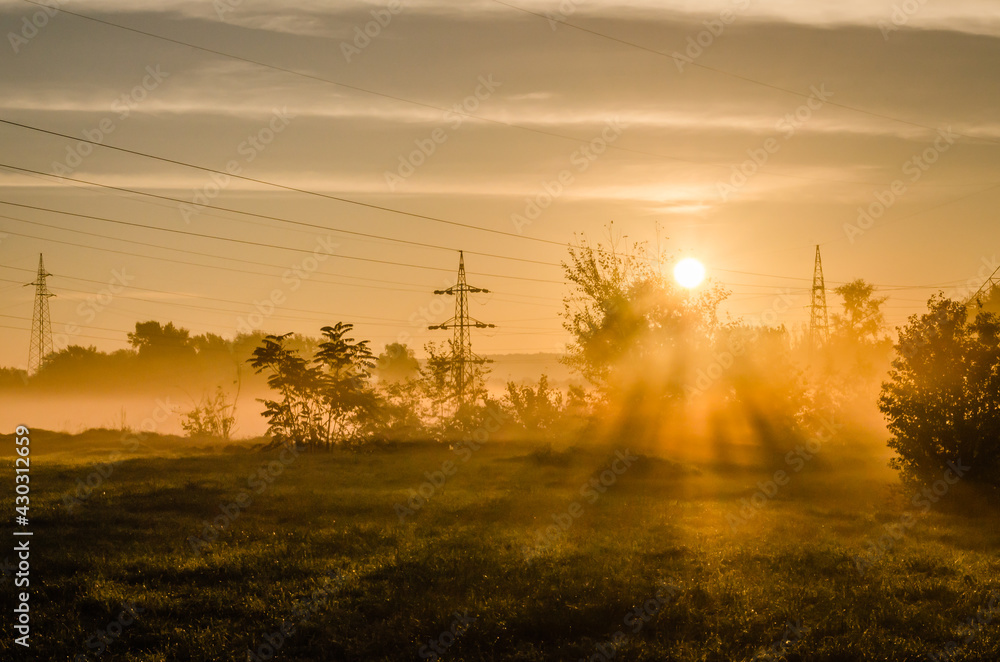 Novi Sad, Serbia - October 22, 2015: Exit from the suburbs near Novi Sad. The exit of the first morning rays of the sun at the exit from the suburbs. Novi Sad, Serbia - October 22, 2015: Exit from the suburbs near Novi Sad. The exit of the first morning rays of the sun at the exit from the suburbs.
