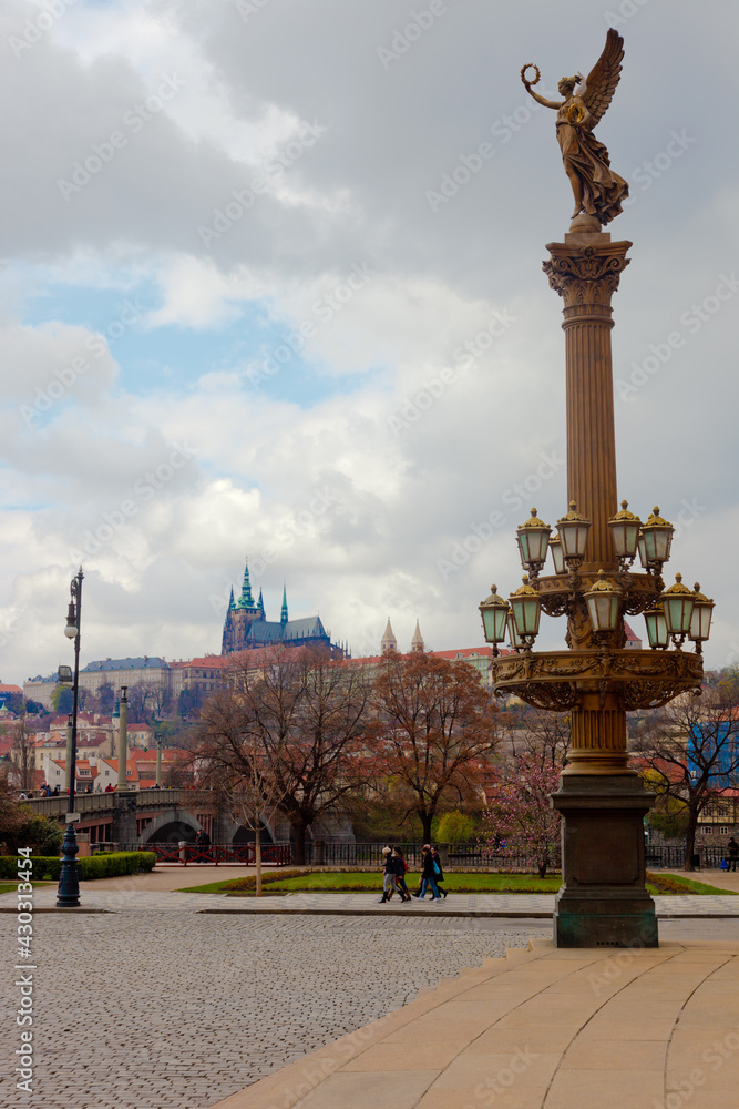 Rudolfinums column in Prague with St. Vitus cathedral in background, Czech Republic.
