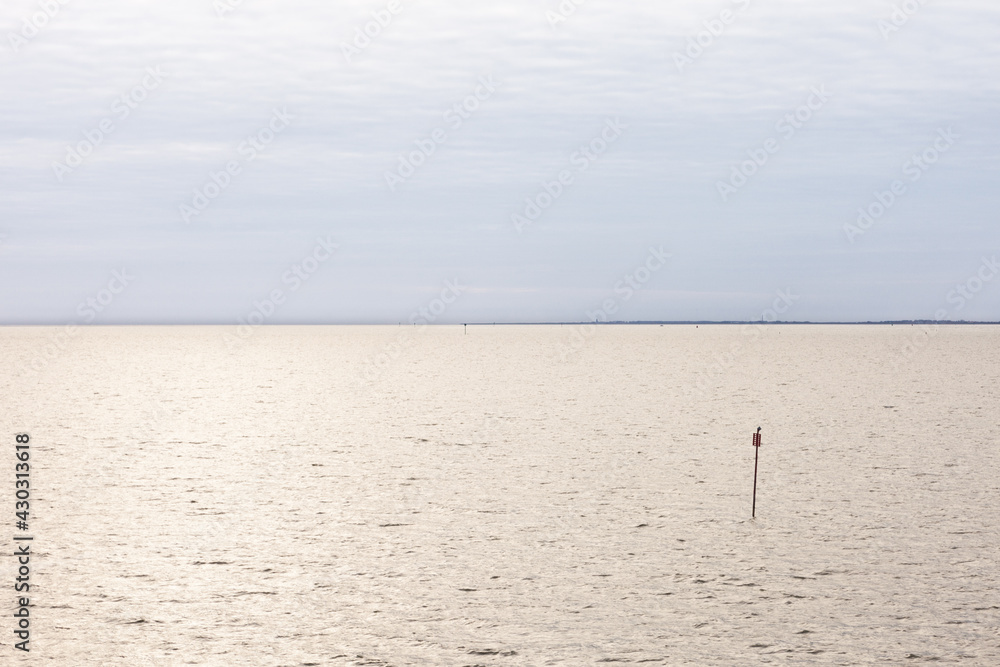 Island of Ameland (Friesland/Fryslan, The Netherlands): pole rising from the sea at high tide