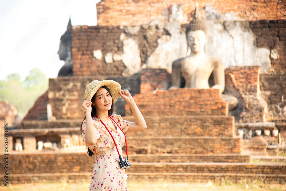 Asian tourists is visiting at Sukhothai in Thailand.Concept Travel