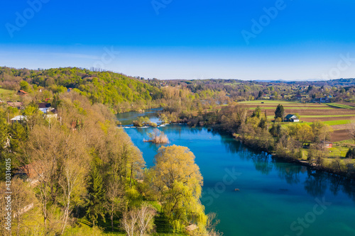 Fototapeta Naklejka Na Ścianę i Meble -  Mreznica river in Croatia from air, drone view of Belavici village in spring