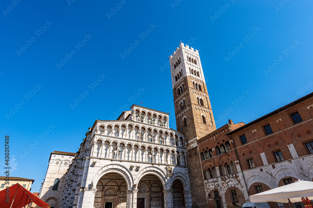 Main facade of the Medieval Cathedral of San Martino (Saint Martin), in Romanesque Gothic style, XI - XII century. Piazza San Martino, Tuscany, Italy, Europe.