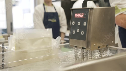 Boiling water in the machine for sous vide cooking. Close up photo