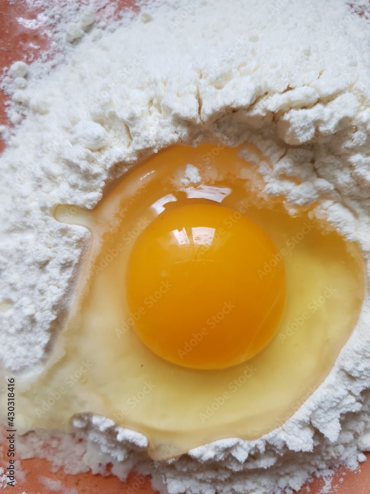 Still life with flour, egg on the kitchen table Still life with flour, egg on the kitchen table
