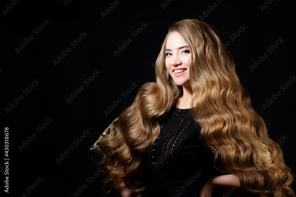 Luxurious golden curls, portrait of a young beautiful woman with beautiful hair,