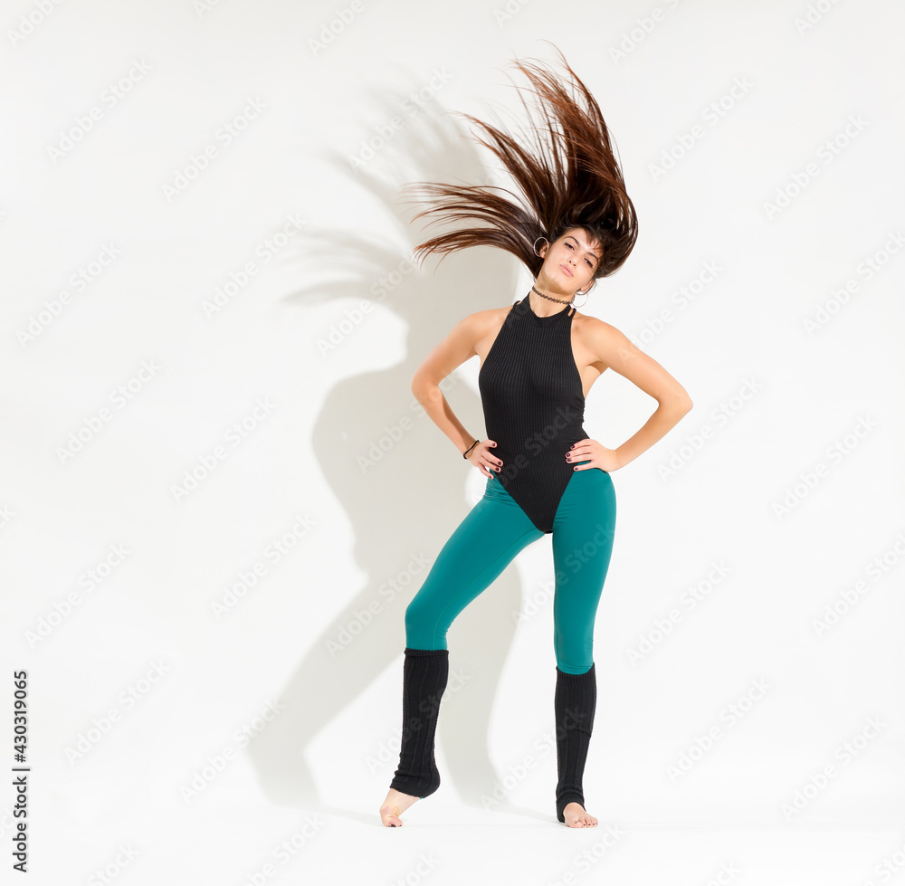 Young dancer in an 80s outfit performing a classical retro dance