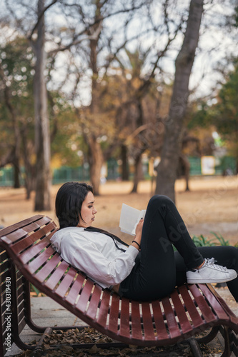 young woman studying outdoors