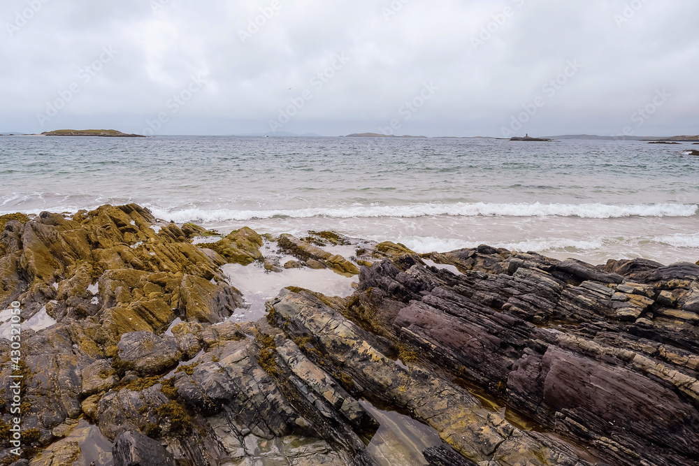 Rough coarse stone coastline and powerful ocean wave. West coast of Ireland. Irish nature landscape. Connemara area.