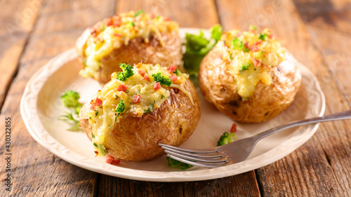 baked potato stuffed with vegetables and cheese