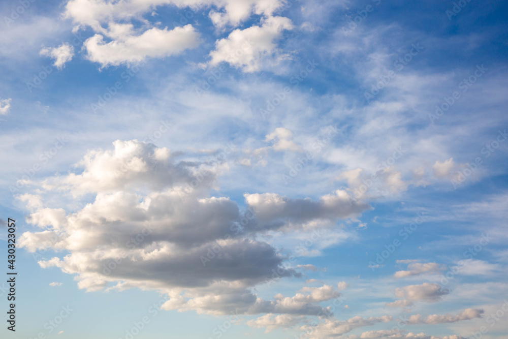 blue sky background with white fluffy clouds