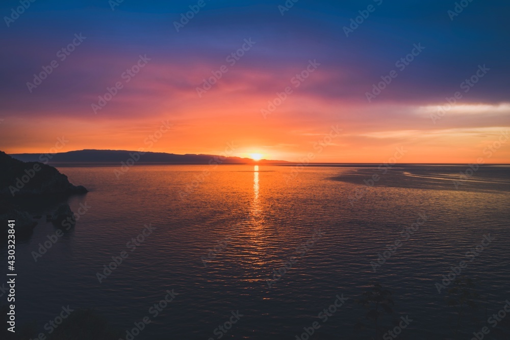 Fototapeta premium Magical sunrise over the sea, tranquil scenery.