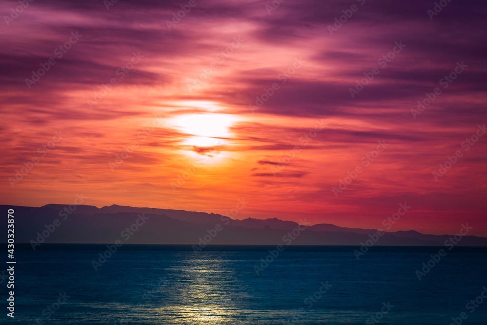 Abstract sunset over the sea. Colorful hazy sky