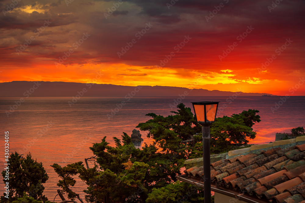 Incredible sunrise scenery over the sea in Taormina, Sicily. Incredible sunrise scenery over the sea in Taormina, Sicily.