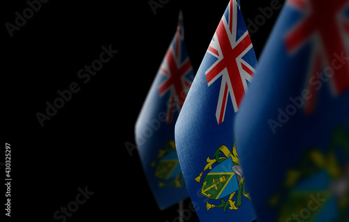 Small national flags of the Pitcairn Islands on a black background photo