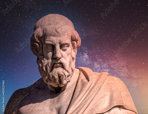 Plato the ancient Greek philosopher and thinker under starry night sky, space for your text photo