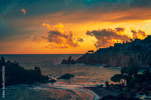 sunset over Isola Bella in Taormina  Sicily 