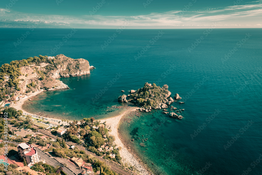 Top view of Isola Bella and the turquoise sea surrounding the shores of Taormina, Sicily 