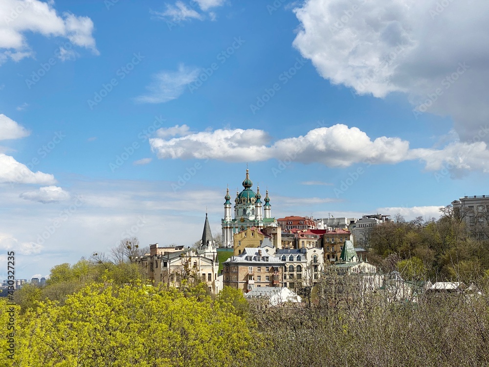 Ukraine Kiev old town cityscape. Old Orthodox St. Andrew's Church on  green hill. Wonderful spring landscape.