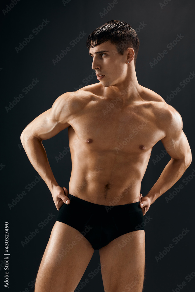 male athlete dark coward muscled body studio dark background male athlete dark coward muscled body studio dark background