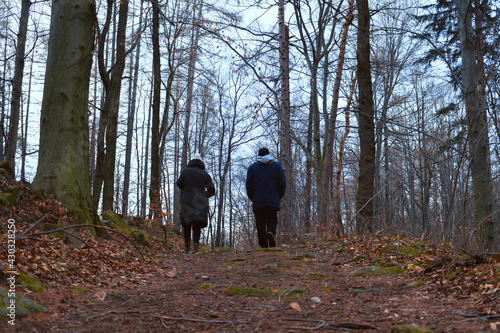 Couple walking on the path on the mountain forest