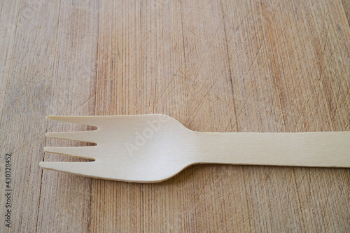 Eco friendly wooden fork on wooden background